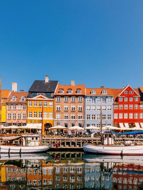 Colourful townhouses and moored boats along Nyhavn, Copenhagen